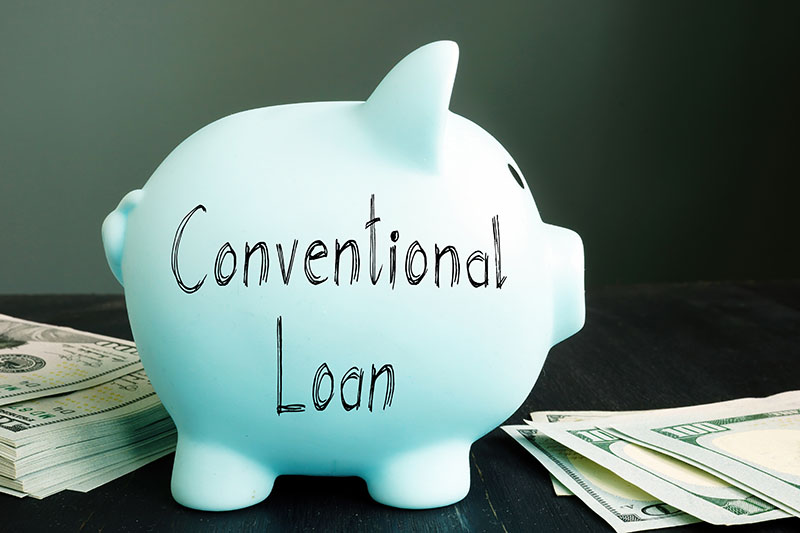 piggy bank with conventional loan written on it
