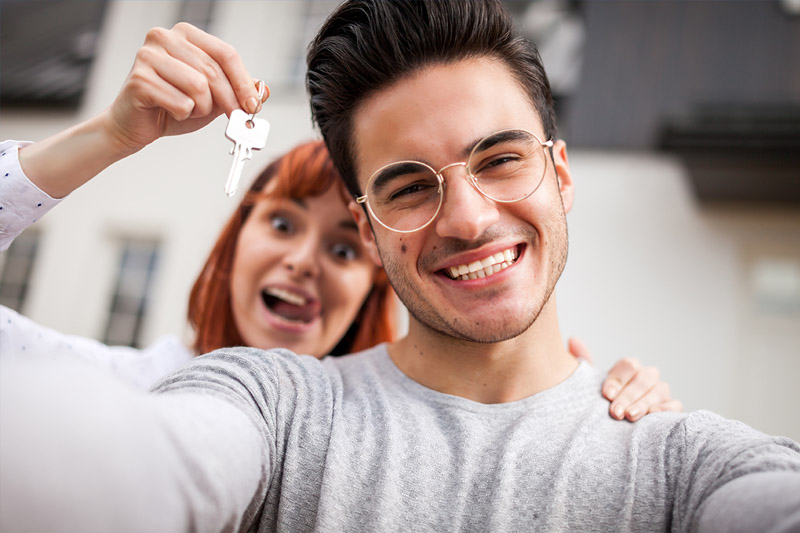 First Time Home Buyer smiling with wife
